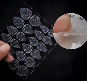 Nail glue and adhesive tabs side by side next to soft gel press-on nails